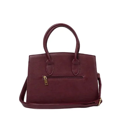 Burgundy handbag with decorative gold buckle